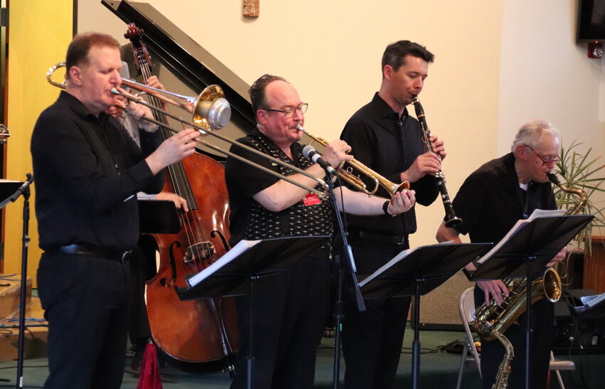 From left, Bob Smith, Jon-Erik Kellso, Evan Arntzen and Russ Whitman of James Dapogny's Chicago Jazz Band play at Evergreen Christian Church.